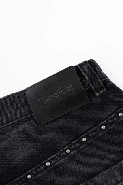 【SUPPLIER】 Studs Tribal Leather Patch Curve Denim ウエストバック革パッチディテール画像
