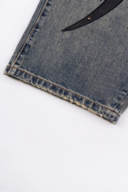 【SUPPLIER】 Studs Tribal Leather Patch Curve Denim（BLUE） 裾加工ディテール