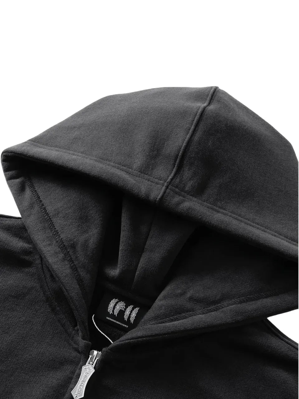 【THE BOY HAS NO PATIENCE】 LUMINOUS DAWN ASTRAL LOGO FLOCKED ZIP HOODIE フードおよびブランドタグのアップ