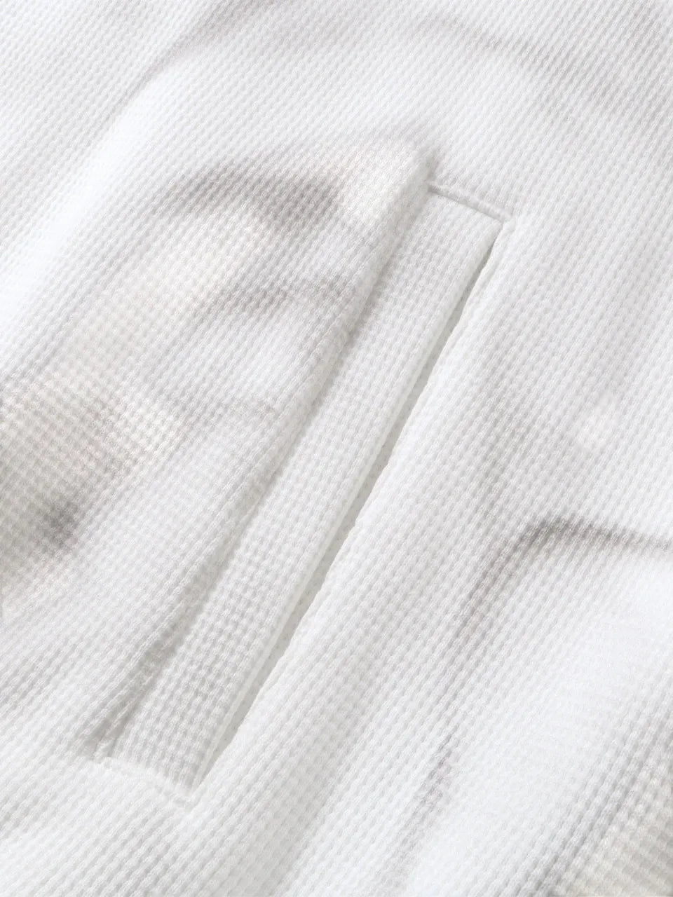 【THE BOY HAS NO PATIENCE】 LUMINOUS DAWN EMBROIDERED LOGO HOODIE （WHITE） 側面のスリットポケット縫製部拡大画像