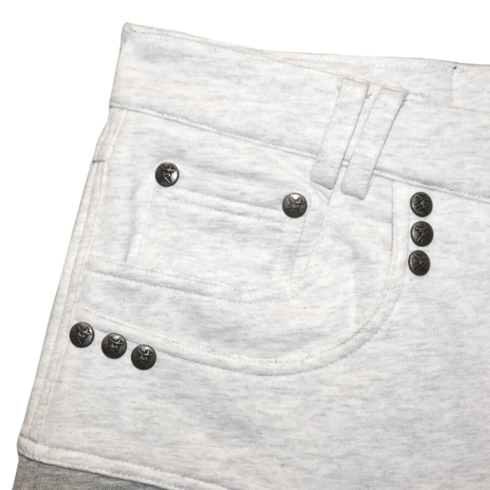 Dray Double-Layered Sweatpants Thought We Friendsのフロントポケット部分アップ画像。ポケット口のスタッズと繊細なダメージ加工。